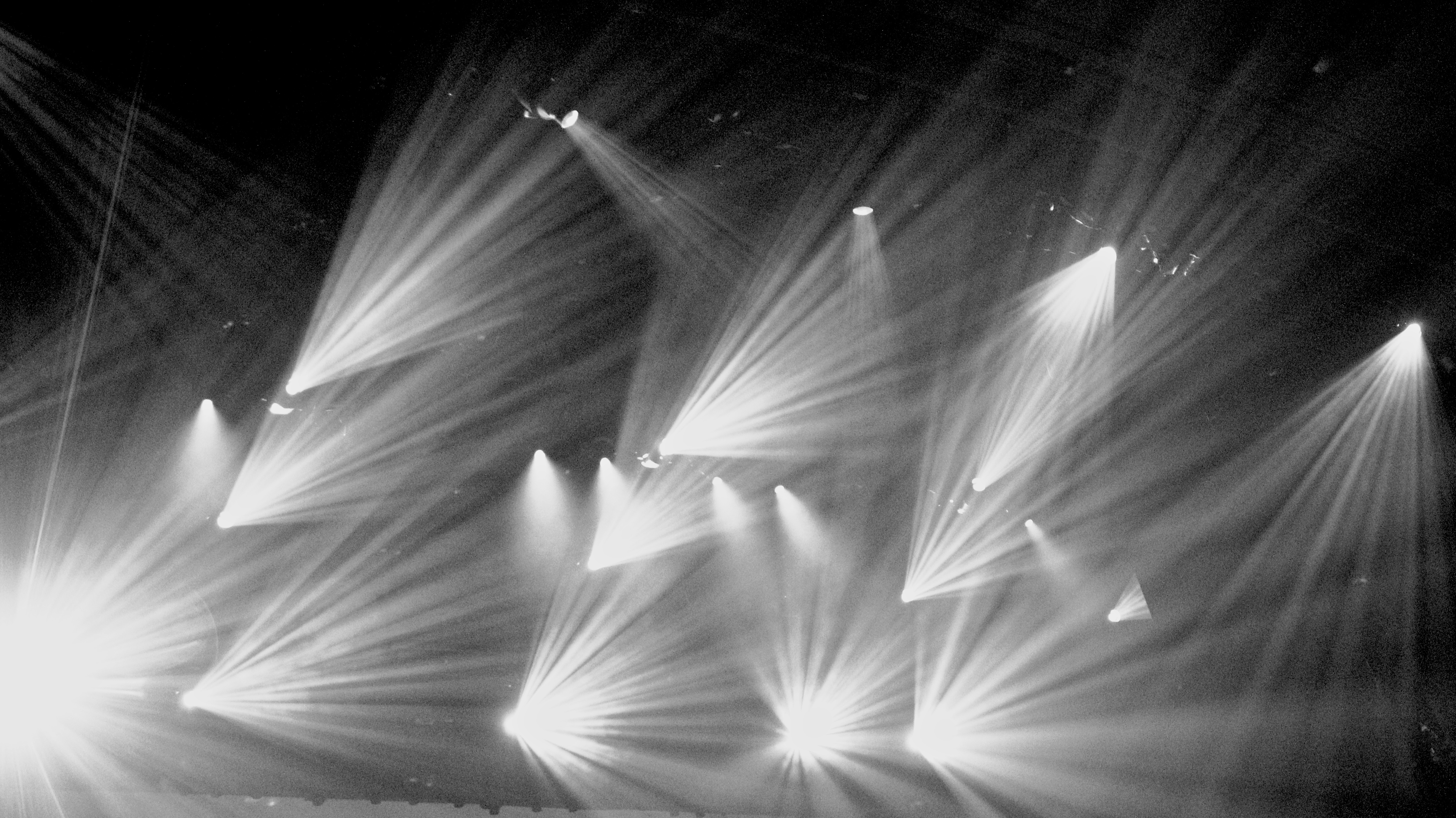 Stage beams cutting through haze