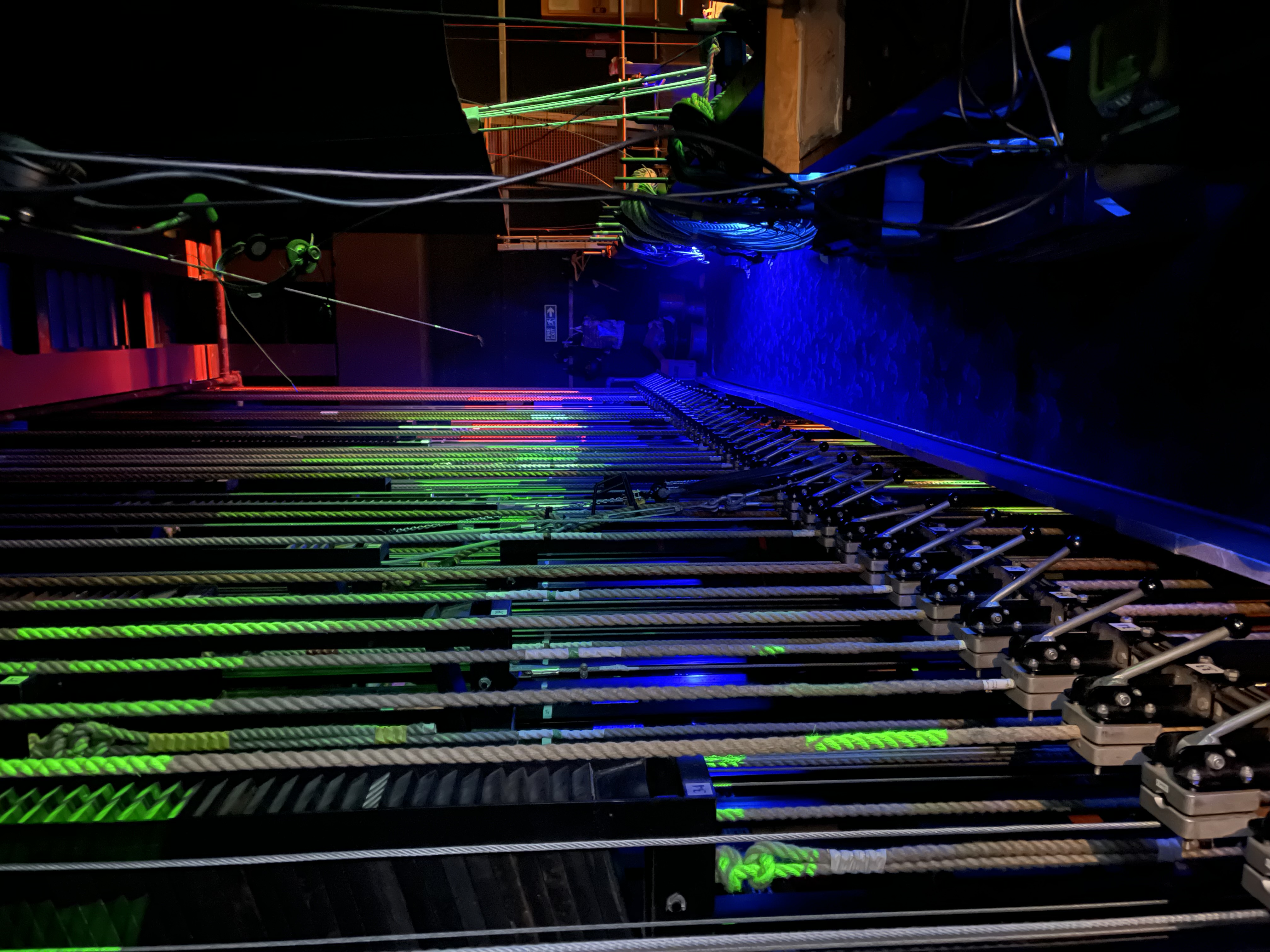 Automated stage equipment under coloured light