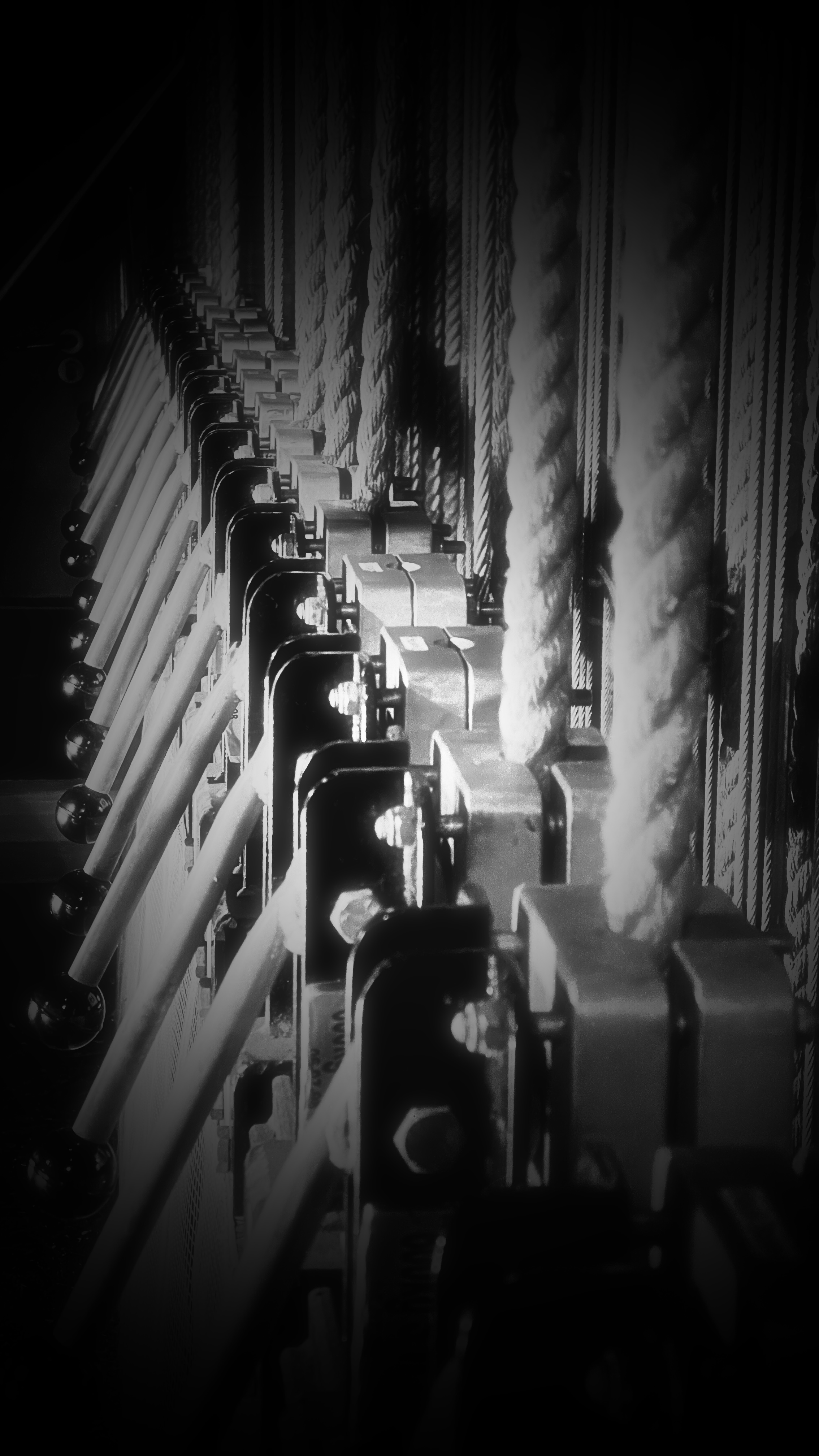 Backstage theatre machinery in black and white